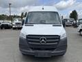 Front view of a 2025 Mercedes-Benz Sprinter van featuring a sleek design with a black grille and large headlights