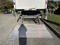 A 2022 Lion Lion6 truck with a lowered hydraulic liftgate at the rear