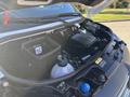 The engine bay of a 2024 Mercedes-Benz Sprinter 2500 featuring various components including air intake and fluid containers
