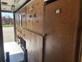 Inside a 2008 Workhorse W62 delivery vehicle with wooden cabinetry featuring various drawers and compartments for storage and organization