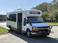 A white 2020 Chevrolet Express bus with the words SAFE BUS displayed on the front and a black grille guard attached to the front bumper