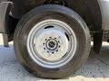 Close-up of a 2019 Ford F-550 wheel with a silver rim and tire showing tread pattern
