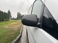 A 2021 Mercedes-Benz Metris with a focus on the side mirror showing raindrops on the surface