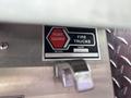 A label on a fire truck indicating it is a Fort Garry model from 2002 with the number 83662