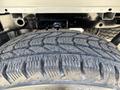Close-up of a 2019 Ford F-150 tire showing tread pattern and rubber texture