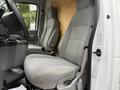 Interior view of a 2022 Ford E-450 showing two gray cloth seats and part of the dashboard