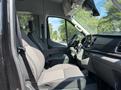 Interior view of a 2025 Ford Transit T-350 showing the driver's seat passenger seat and dashboard with controls and display