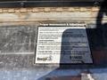 A label detailing proper maintenance and adjustments for a 2016 Isuzu NPR-HD truck with instructions for adjusting paddle latches and T-handles