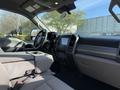 Interior view of a 2021 Ford F-250 SD showing the front dashboard seats and center console