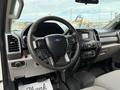 Interior view of a 2019 Ford F-350 SD showcasing the steering wheel dashboard and control panel