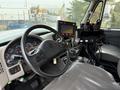 Interior view of a 2016 International 7600 showing the driver's seat dashboard and various controls including gauges and digital displays