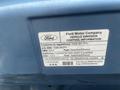A label from a 2009 Ford Econoline displaying emission control information and vehicle specifications including fuel type and compliance details