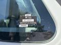 A close-up of a 2011 International 4300's windshield containing a British Columbia Certificate of Approval sticker showing details and an expiration date