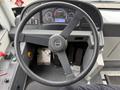 Steering wheel of a 2018 Grande West Vicinity bus with visible dashboard controls and instrumentation in the background