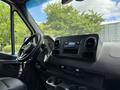 Interior of a 2022 Mercedes-Benz Sprinter showing the steering wheel dashboard and control panel