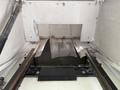 Inside view of a 2011 Freightliner M2 106 revealing a metal panel and tracks with visible wear and tear