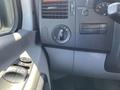 Interior dashboard of a 2010 Mercedes-Benz Sprinter showing light control switch and air vent with control knobs