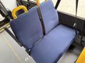 A blue cloth seat with a seatbelt designed for safety inside a vehicle