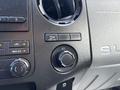 Dashboard controls of a 2016 Ford F-750 featuring dials for air conditioning and a 12V power outlet
