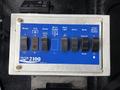 A control panel featuring various switches and buttons for operating functions such as lights vacuum and blower on a 2013 International Workstar 7500