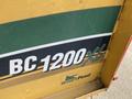 A yellow and green sign displaying the model name BC1200XL and the Smart Feed logo from Vermeer Corporation