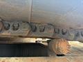 Close-up of a 2018 Caterpillar 326F L Excavator track assembly showing rusted metal links and a drive sprocket
