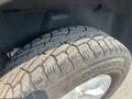 A close-up of a tire on a 2015 RAM 1500 showing a detailed tread pattern and the brand name Nokian on the sidewall