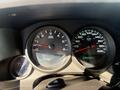 The dashboard of a 2013 Chevrolet Silverado 1500 showing speedometer tachometer and gear indicator with dials and digital displays