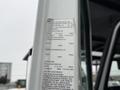 A 2020 International MV607 truck featuring detailed specifications including tire sizes and weight ratings on a placard attached to the vehicle's interior