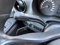 Close-up of a control lever for indicators on the steering column of a 2019 Mercedes-Benz Sprinter with dashboard gauges visible