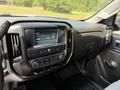 A 2016 Chevrolet Silverado 2500HD dashboard featuring a touchscreen display and various control buttons