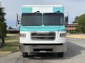 A 2020 Freightliner MT45 with a turquoise and white color scheme featuring large front windows and a grill with horizontal slats