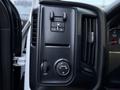 Control panel of a 2017 GMC Sierra 3500HD featuring buttons for headlights and interior lighting adjustments