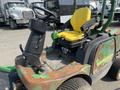 A 2012 John Deere 1445 Series II 4WD riding mower with a yellow seat and a control panel visible on the left side