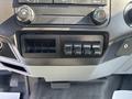Dashboard controls of a 2018 Ford F-750 featuring four auxiliary switches and climate control knobs