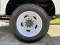 Close-up of a white rim and tire from a 2024 Ford F-550 showing the tire tread pattern and wheel design