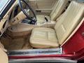 Interior of a 1970 Chevrolet Corvette featuring beige leather seats and a classic dashboard design