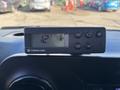 A black Thermo King temperature control unit displaying 12 degrees Celsius with buttons for adjustment placed on the dashboard of a 2021 Mercedes-Benz Sprinter 2500