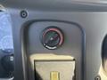 A control dial for a Webasto heating system located on the dashboard of a 2005 Freightliner M2 106 truck