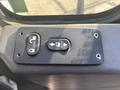 Control panel featuring buttons for door and auto functions from a 2008 International 4400 vehicle