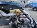 Close-up view of the engine compartment of a 2015 Ford F-550 showing various components including hoses and a battery