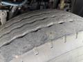 Close-up of a worn tire on a 2016 Freightliner 108SD showing visible tread depth loss and surface wear