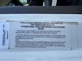 A close-up of a label on a vehicle displaying vehicle noise emission control information for a 2008 International 7500 truck