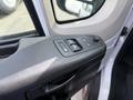 Close-up of the driver's side door panel of a 2017 RAM Promaster featuring window controls and a door handle