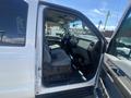 A 2016 Ford F-350 SD with an open driver's side door showing the interior seating and dashboard