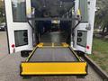 A 2021 Ford Transit-350 with a lowered ramp for accessible entry visible at the rear doors