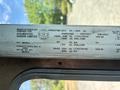A 2012 Ford Econoline vehicle identification plate displaying weight and manufacturing information