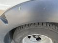 A close-up of the wheel and tire of a 2020 Chevrolet Express showing the tire tread and part of the vehicle's fender