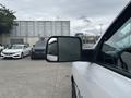 A 2016 RAM 1500 truck with a detailed side mirror reflecting the view beside it