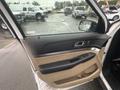 Interior view of a 2016 Ford Explorer door showing the armrest control panel and window switch